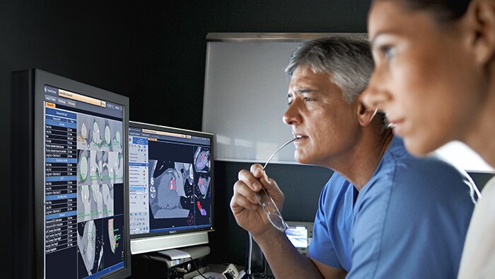 patient in mr machine with nurse doctor