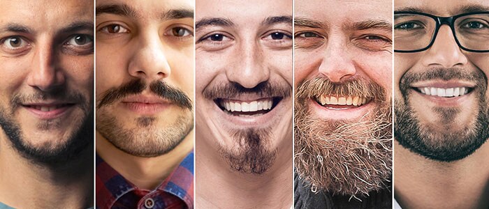 Collage di ritratti di sette uomini con diversi stili di barba che sorridono guardando davanti a loro.